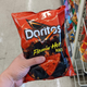 hand holding flamin hot doritos